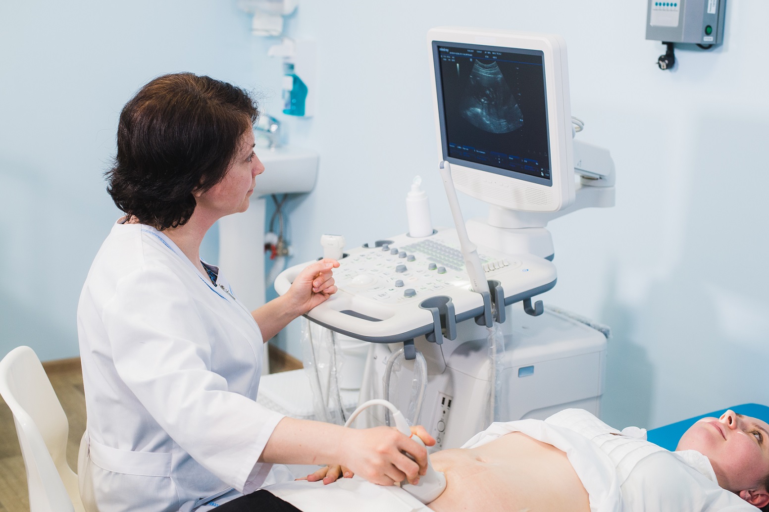 Nurse with patient during clinical assessment